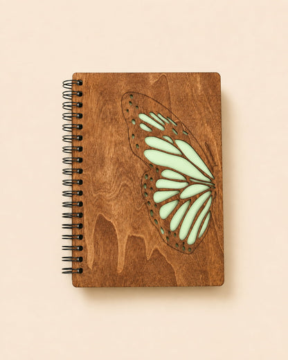 Wooden spiral journal with engraved butterfly design and colored to show detail 