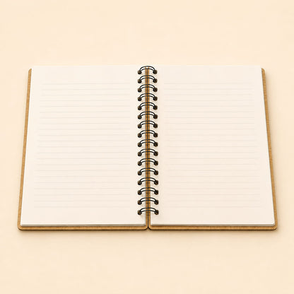 An open spiral-bound notebook with lined pages, shown from above on a warm beige background.