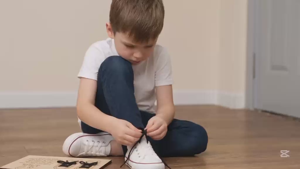 Child practising shoe tying using the BLASCA learning board